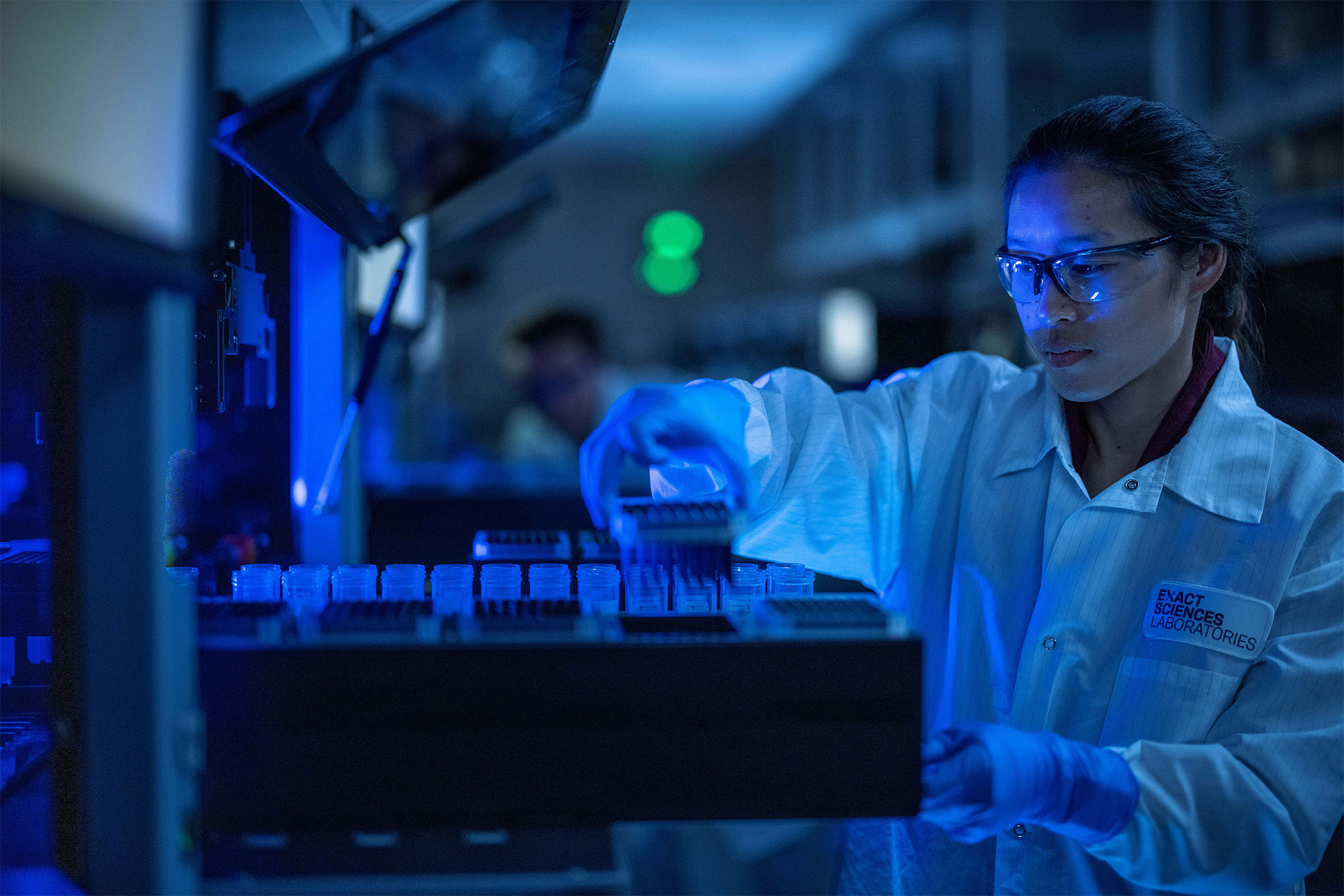 A lab technician processing a Cologuard sample.
